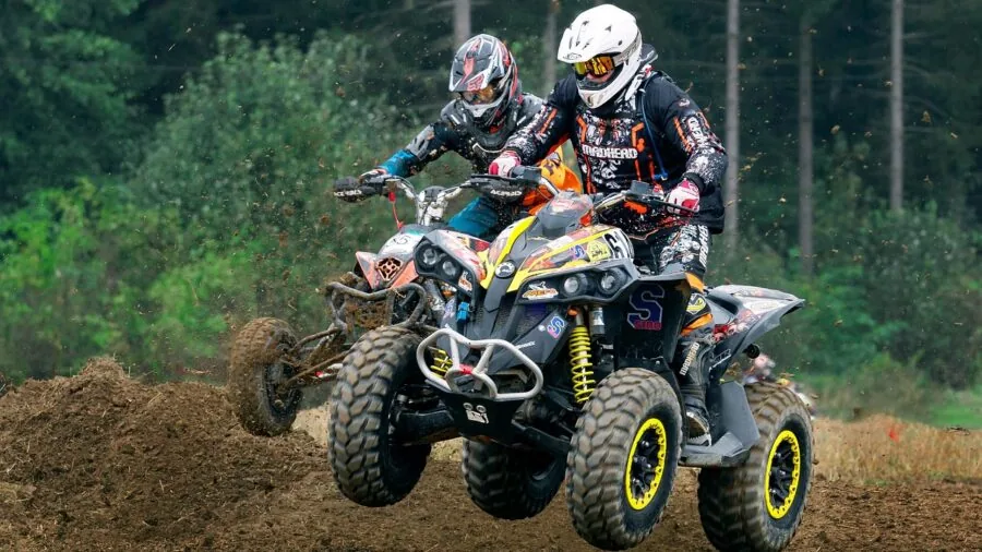 4x4 vehicle navigating through challenging muddy off-road terrain in natural landscape