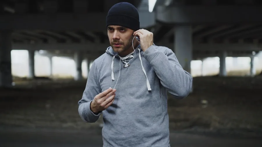 Active person adjusting wireless earbuds while jogging outdoors in natural daylight
