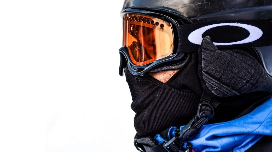 Active person enjoying winter sports outdoors with proper cold weather gear