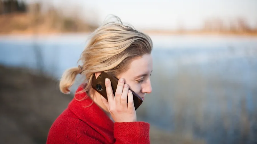 Active person taking a phone call while exercising outside in natural daylight