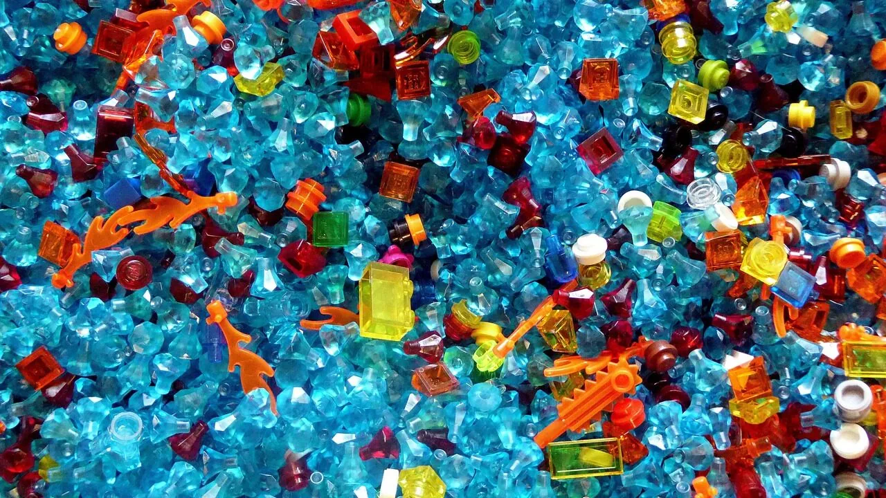 Assorted building block sets with various colored bricks and completed structures