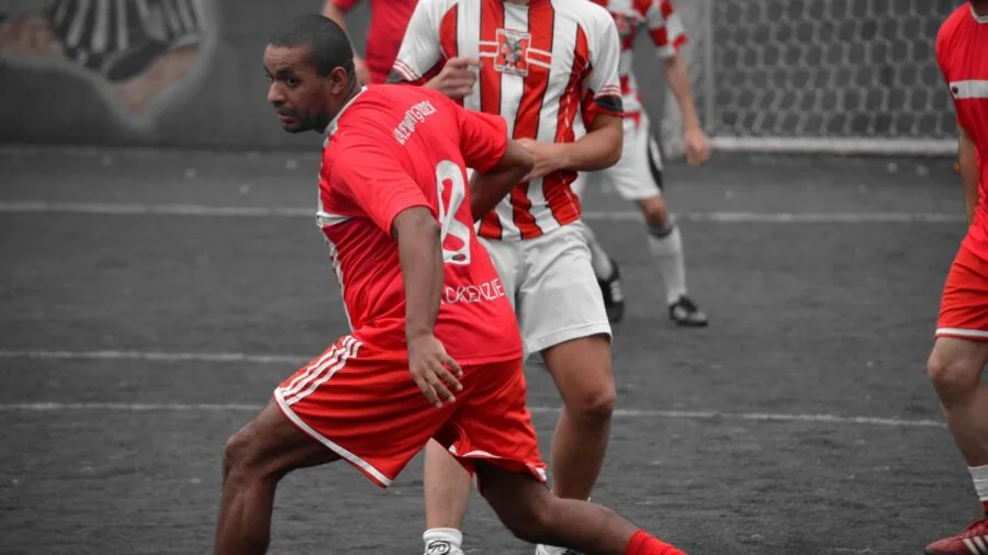 Athlete communicating during intense sports competition, showing focus and breathing during physical activity