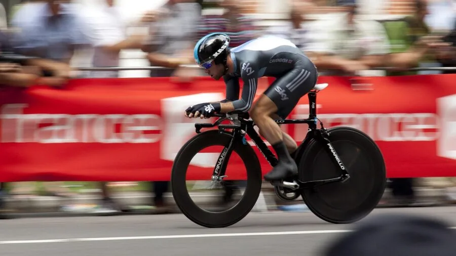 Athlete pedaling on stationary bike during intense cardio workout session