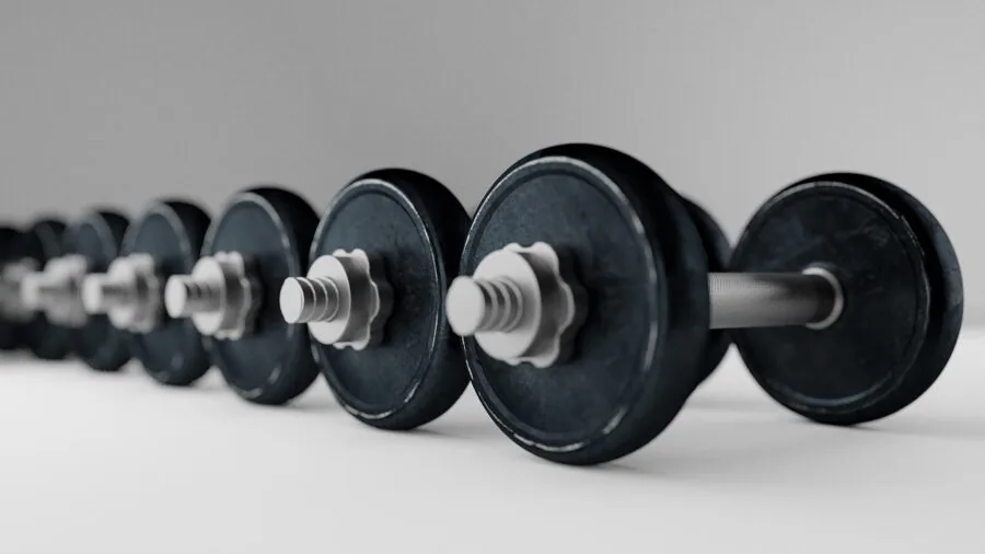 Athlete performing heavy barbell lift with proper form and safety setup in gym environment