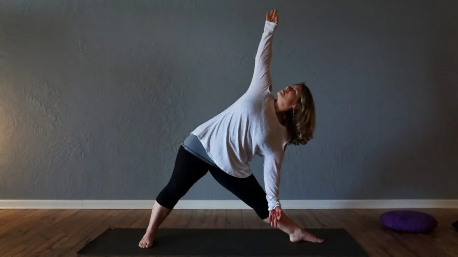 Athlete performing workout on thick foam mat in home gym studio