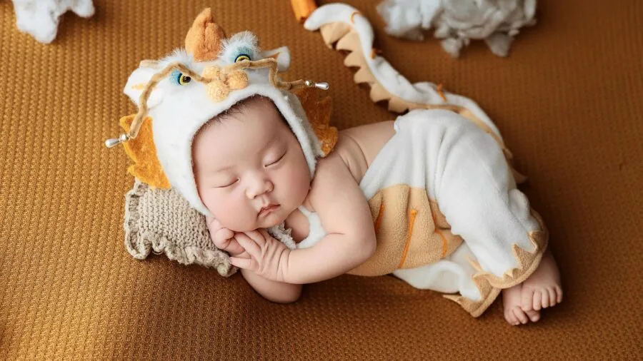 Baby exploring colorful sensory materials and textures during early developmental play