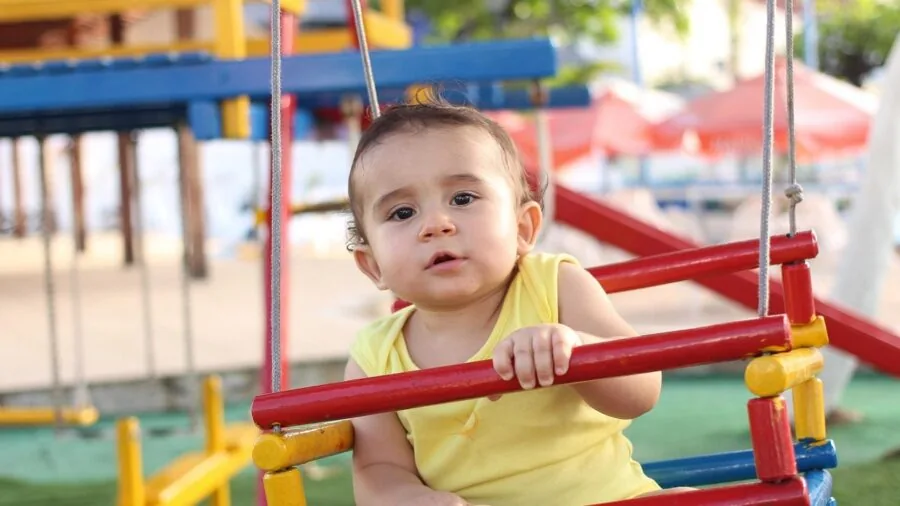 Baby exploring toys and engaging in sensory play for healthy developmental stimulation