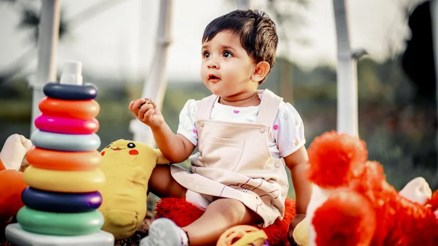 Baby sitting on floor engaging with colorful stacking rings and developmental toys during playtime