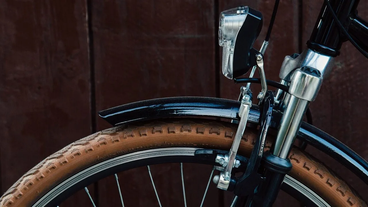 Bike pump inflating a bicycle tire in close-up detail