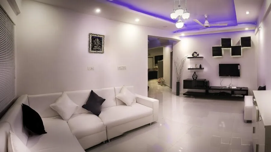 Bright home gym interior showing tall ceilings and floor space for exercise equipment setup
