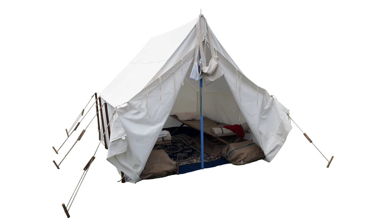 Camping pillows arranged on sleeping bag inside tent for outdoor sleep comfort