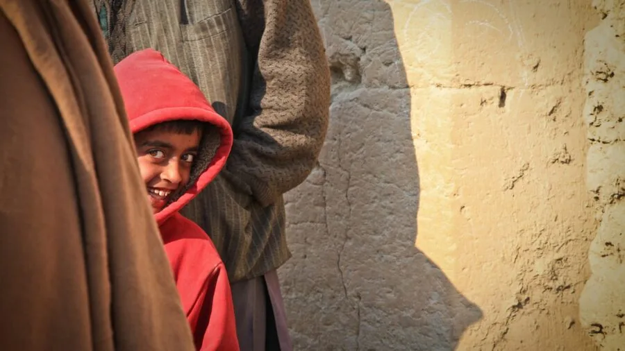 Child in warm hoodie enjoying outdoor activity, demonstrating comfort and fabric quality in real-world use