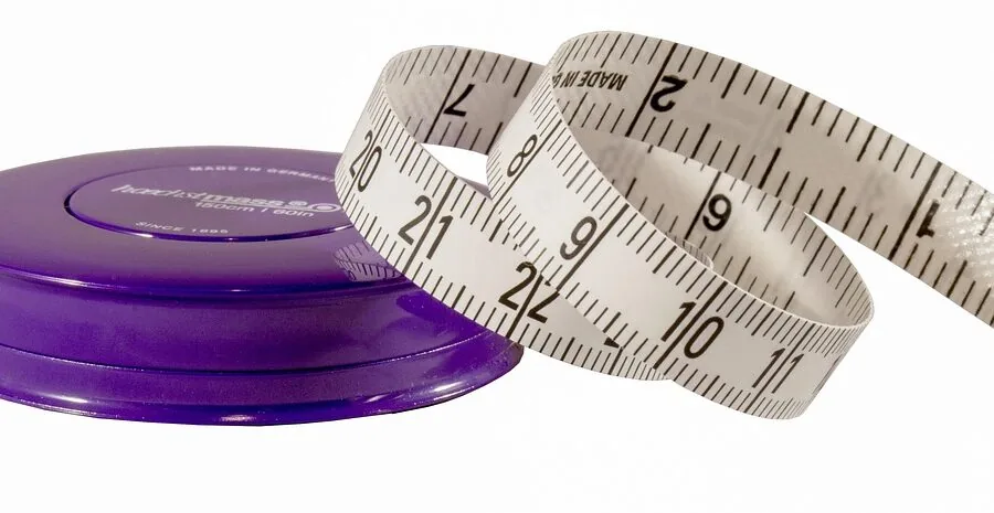 Child's inseam measurement being taken to determine proper bike fit and sizing