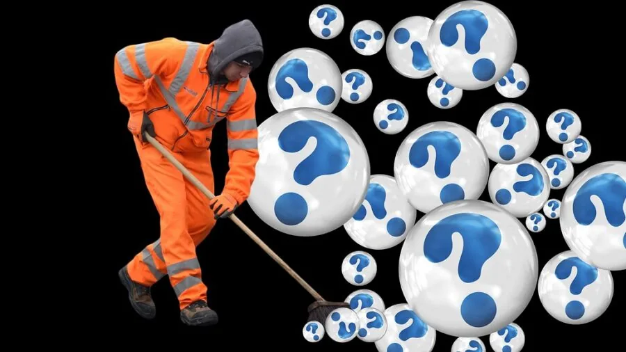 Cleaning staff managing waste disposal in high-traffic commercial environment