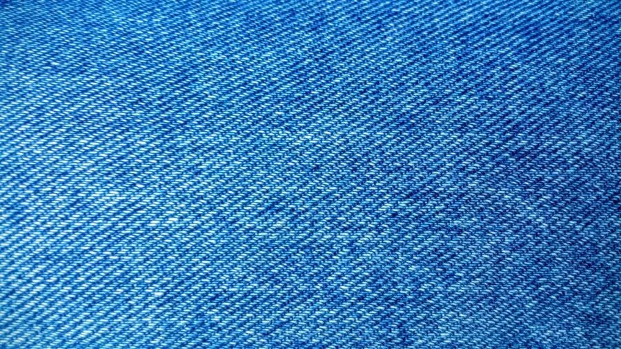 Close-up detail of denim weave showing thread quality and stitching durability