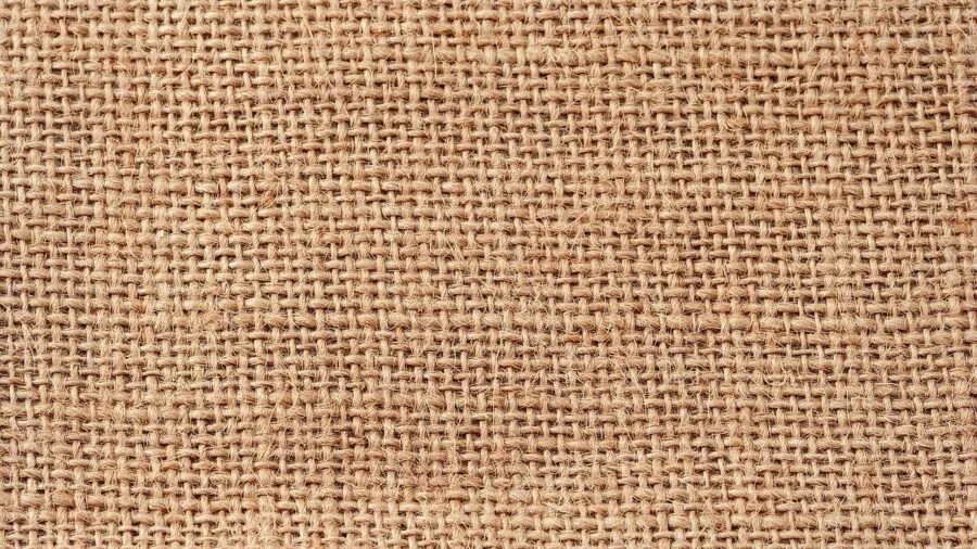 Close-up detail of woven jute rope texture showing natural fiber construction and weave pattern
