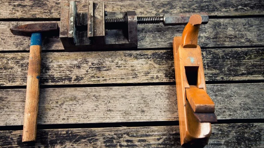 Close-up of a metal workbench frame showing robust construction and welded joints for heavy load capacity
