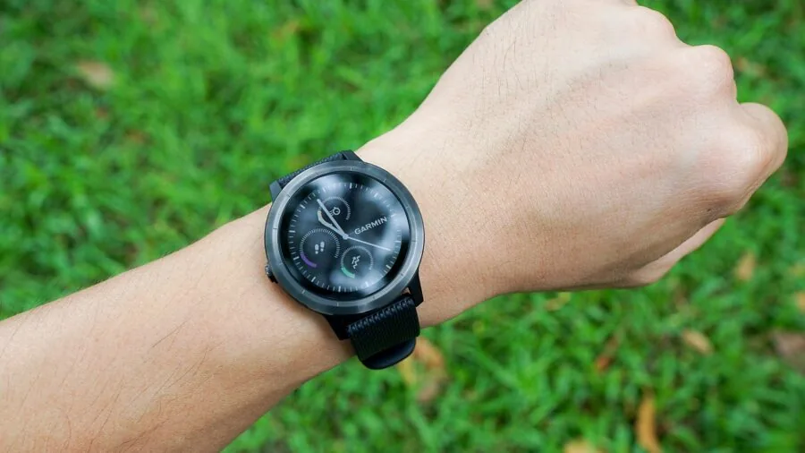 Close-up of a person's wrist showing a fitness tracker during an outdoor activity