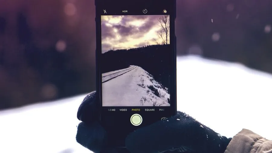Close-up of a runner's hands wearing fitted gloves during a cold weather outdoor run