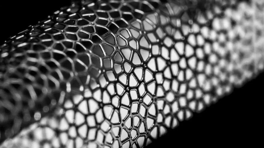 Close-up of a sharp stainless steel blade surface showing reflective metallic details and edge sharpness