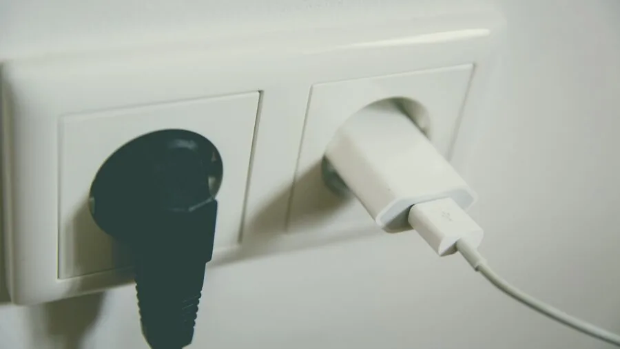 Close-up of a vehicle's 12V power outlet and charging port in the dashboard