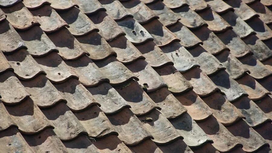 Close-up of a worn yoga mat surface showing signs of wear and tear from regular practice