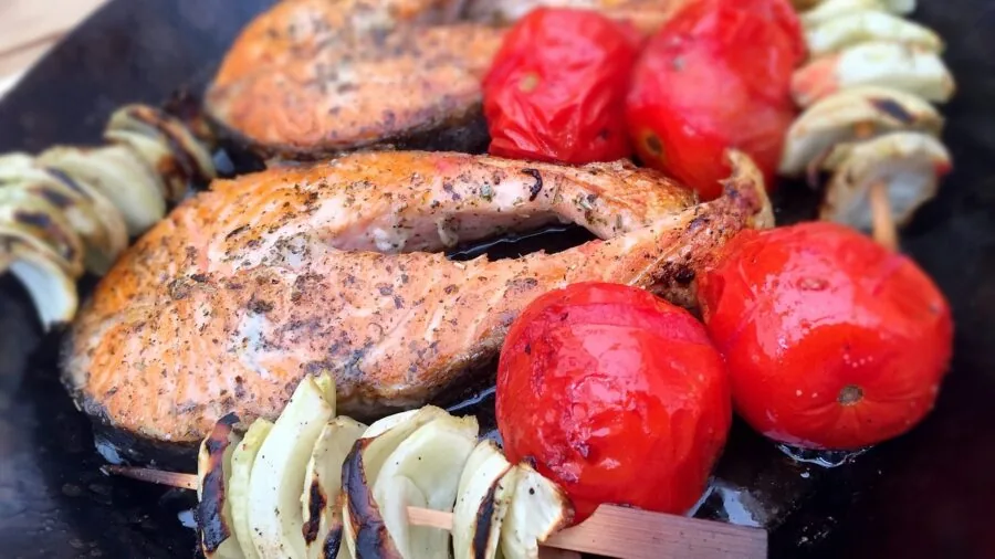 Close-up of cast iron grill grates with sear marks during outdoor cooking