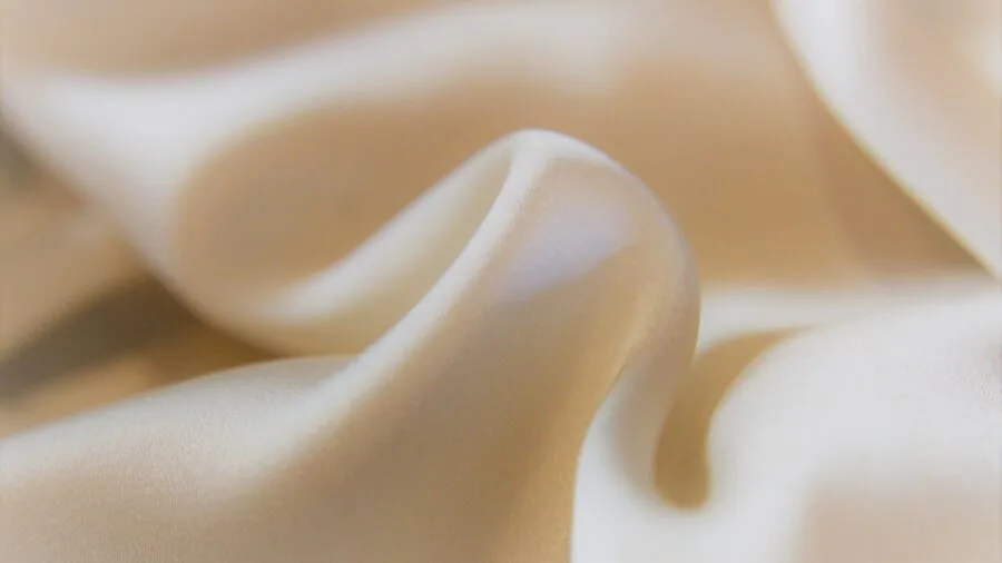 Close-up of different fabric textures and materials being compared for quality and durability