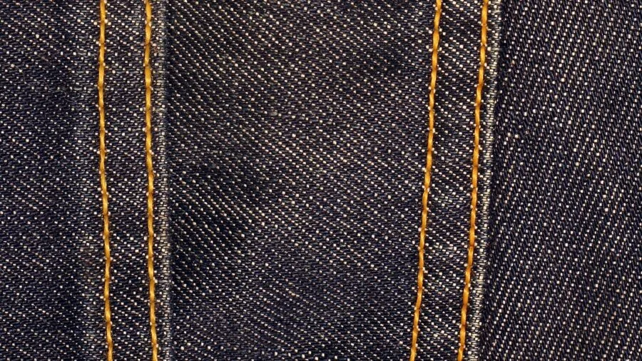 Close-up of durable fabric material showing texture and wear patterns from heavy use
