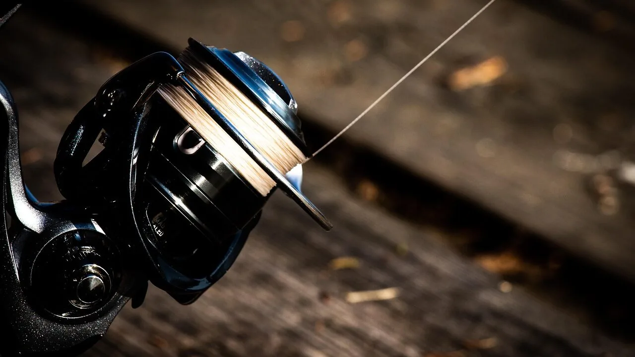 Close-up of fishing spinning rod with reel in natural light