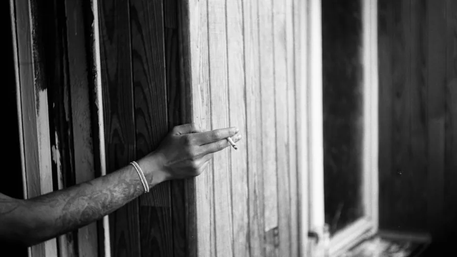 Close-up of hands applying caulk to window frame during home improvement project