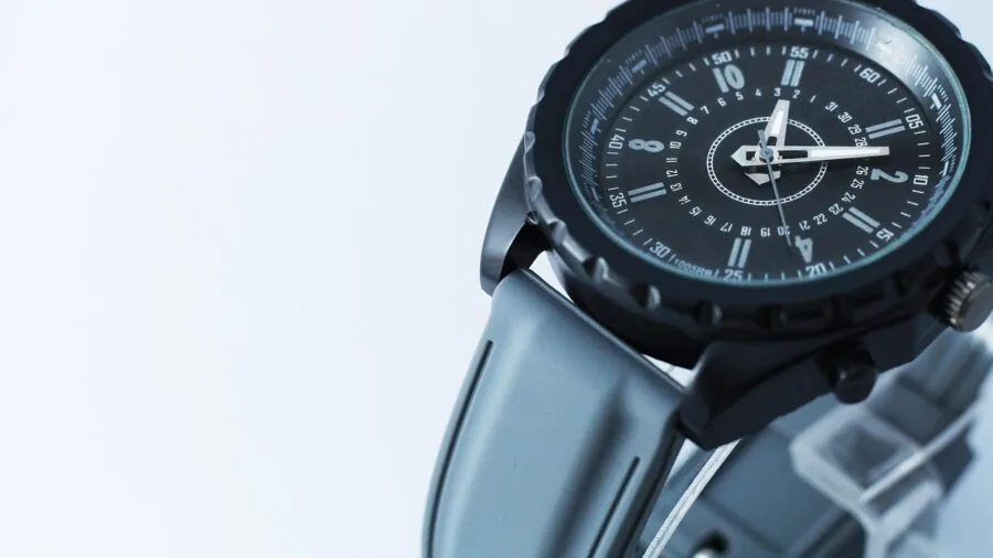 Close-up of hands carefully measuring watch strap width with precision tools
