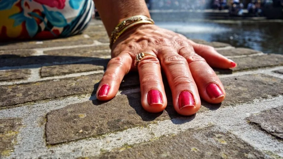 Close-up of hands examining different wrist support products for injury prevention and recovery