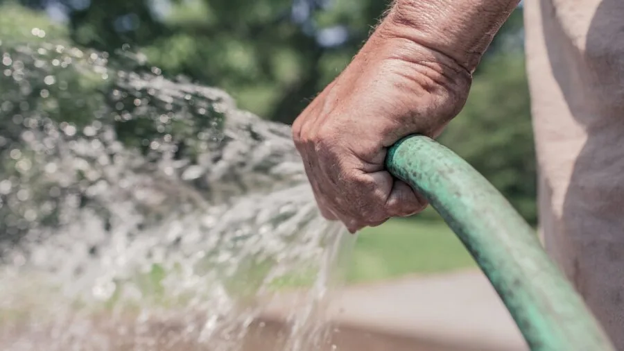 Close-up of hands gripping a secure handle during water sports activity