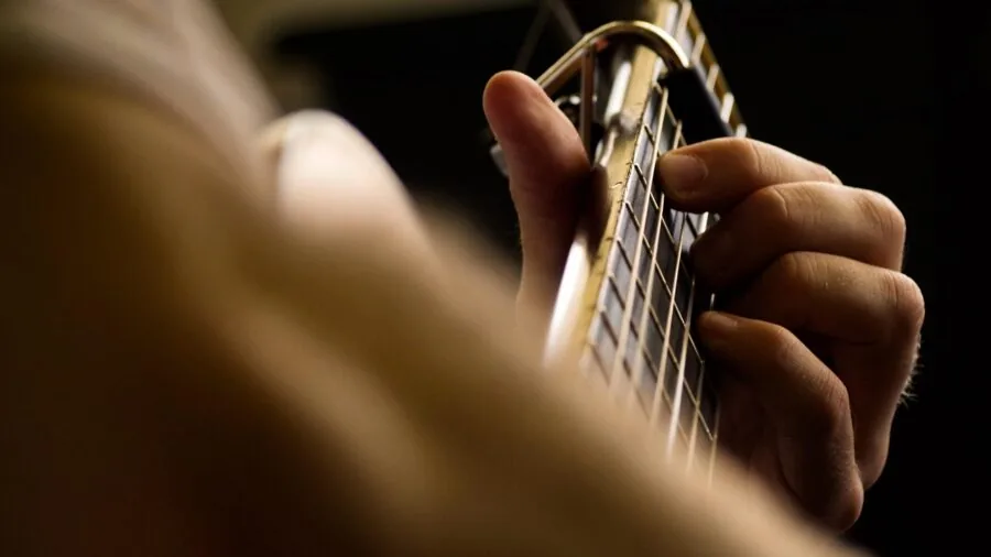 Close-up of hands gripping workout equipment handle during exercise session