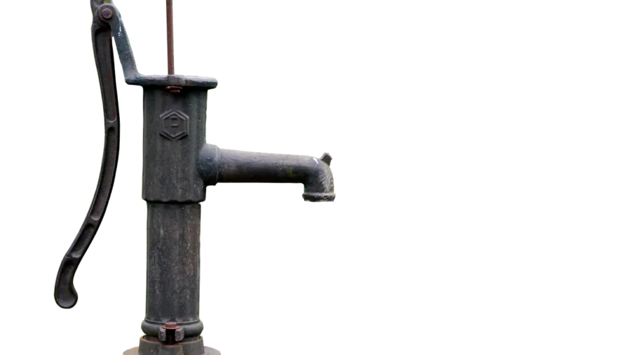 Close-up of hands inspecting a steel bike pump barrel for quality and wear resistance