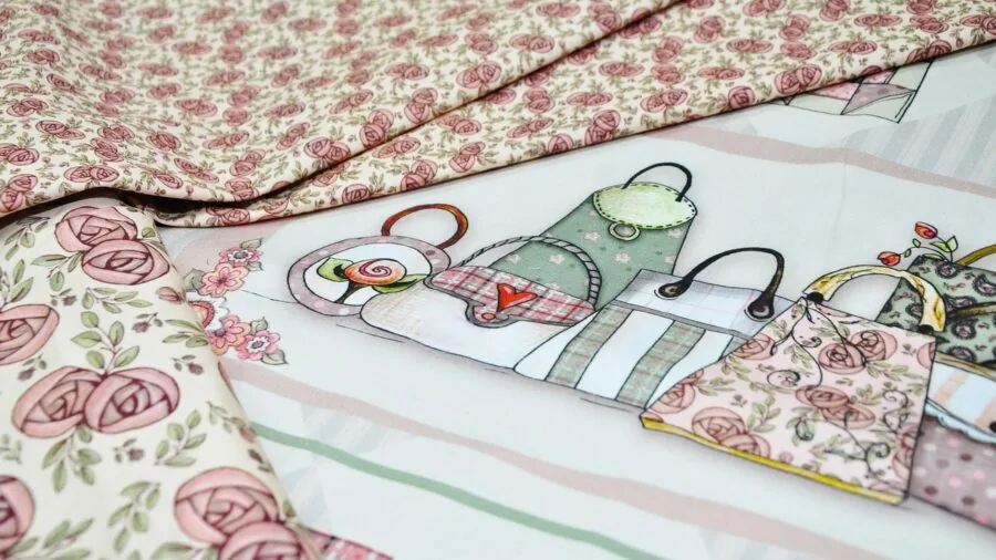 Close-up of hands measuring quilted fabric with precision ruler, showing detailed stitching and marking accuracy