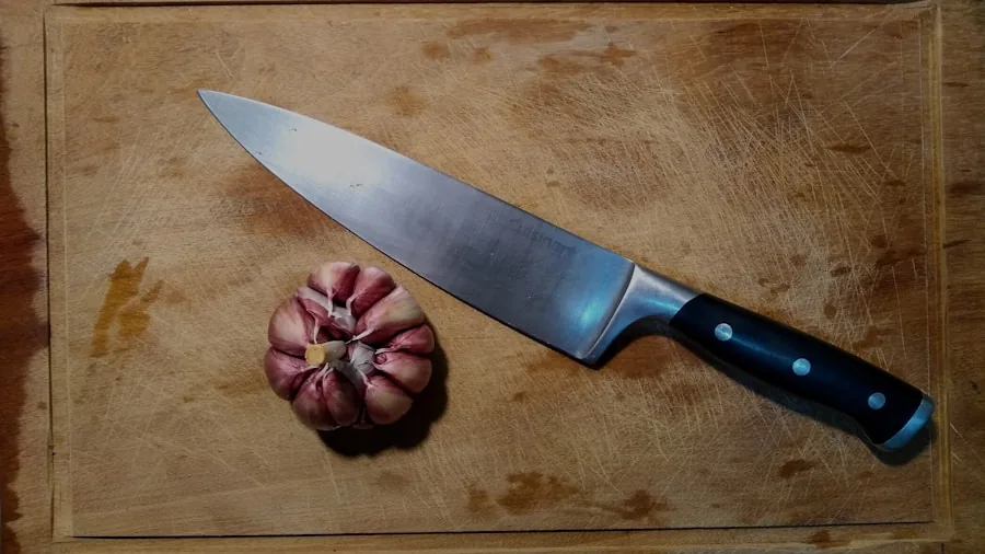 Close-up of knife blade edge being sharpened on steel, showing detail of blade composition and sharpening technique