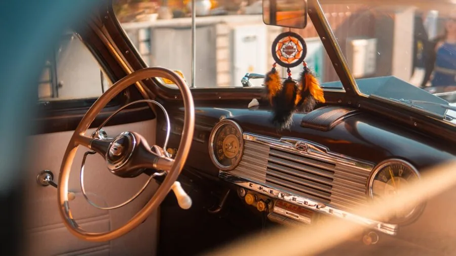 Close-up of leather car interior showing texture and durability in natural light