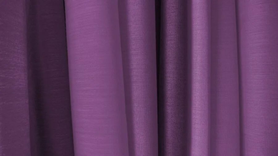 Close-up of luxurious fabric textures showing different weaves and drape qualities in natural light