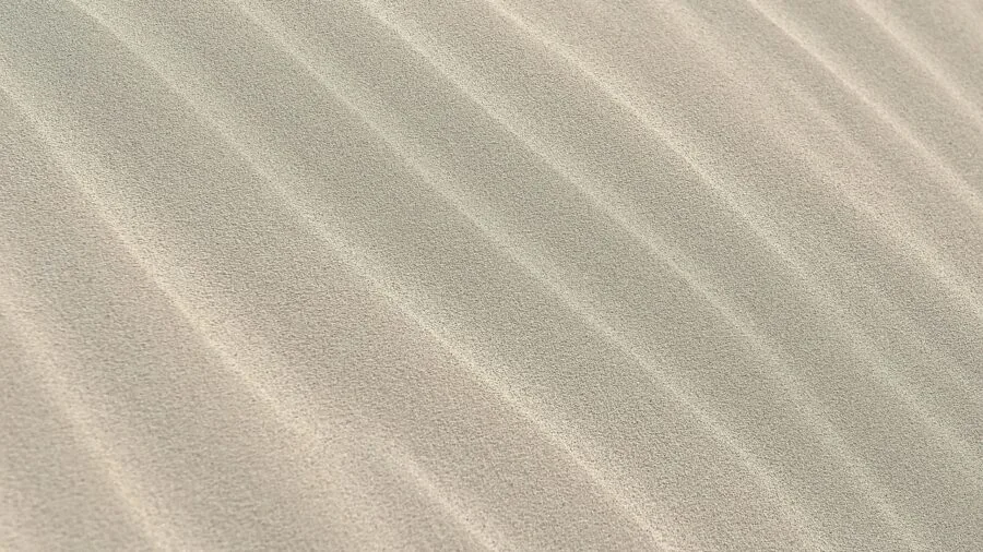Close-up of man's hand feeling high-quality fabric material and texture