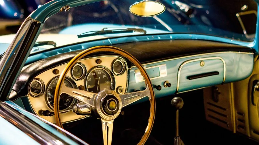 Close-up of modern car interior showing dashboard and seat upholstery details in natural lighting