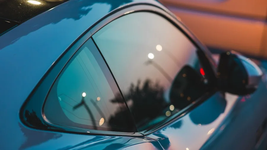 Close-up of shiny car paint surface showing deep gloss and water beading reflections