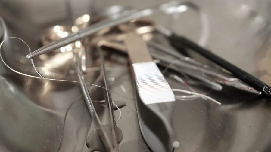Close-up of shiny stainless steel tool handles showing metallic finish and durability