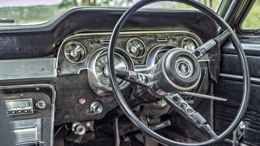 Close-up of smartphone mounted on car dashboard during daytime driving