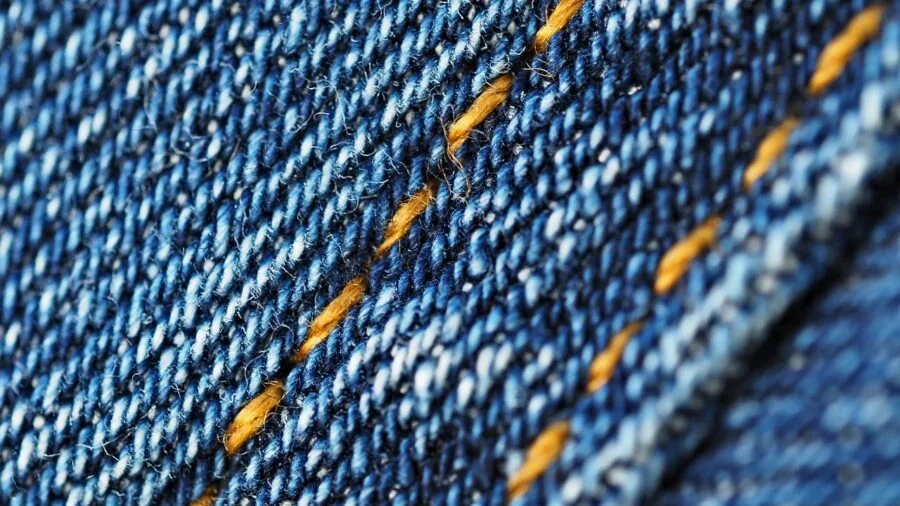 Close-up of soft, breathable fabric texture showing weave and material quality for bedding