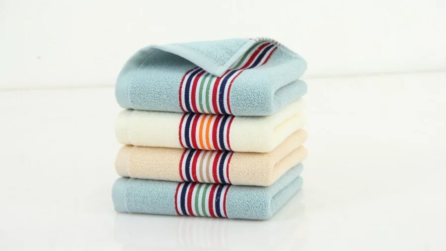 Close-up of soft, fluffy baby towel freshly laundered and folded, demonstrating durability and care