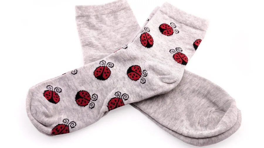 Close-up of someone's feet in soft cotton socks, relaxed and comfortable indoors