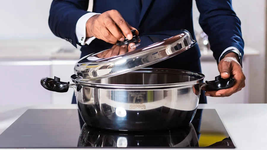 Close-up of stainless steel cooking pot interior with food preparation in kitchen setting