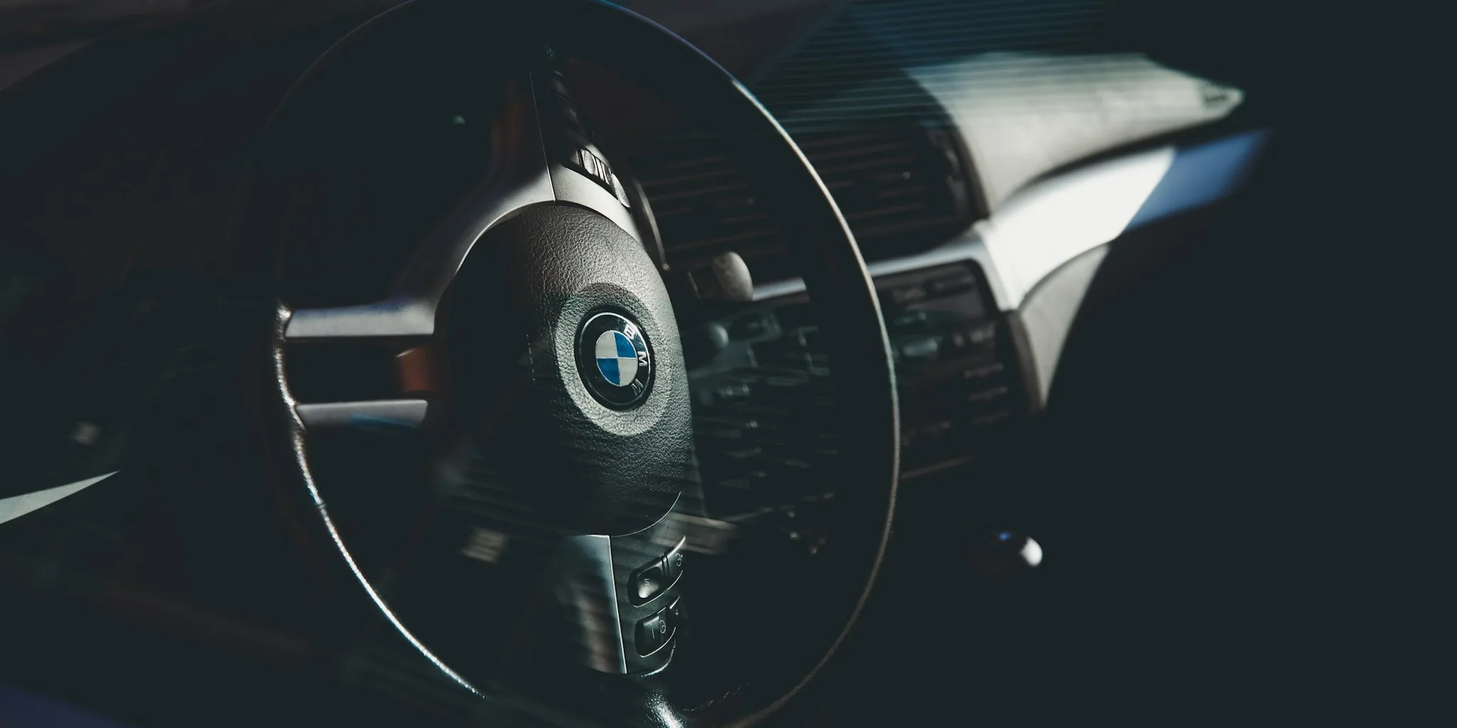 Close-up of steering wheel cover on vehicle steering wheel in car interior